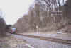 Zug nach Köln-Hansaring passiert Doppelmasten beim ehem. Hp. Gummersbach-Nord, Blick in Richtung Nord-Ost (13.3.2004), (c) Alex M.